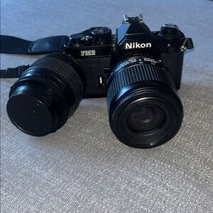 Nikon FM2 Film SLR Camera in Black with Two Black Lenses